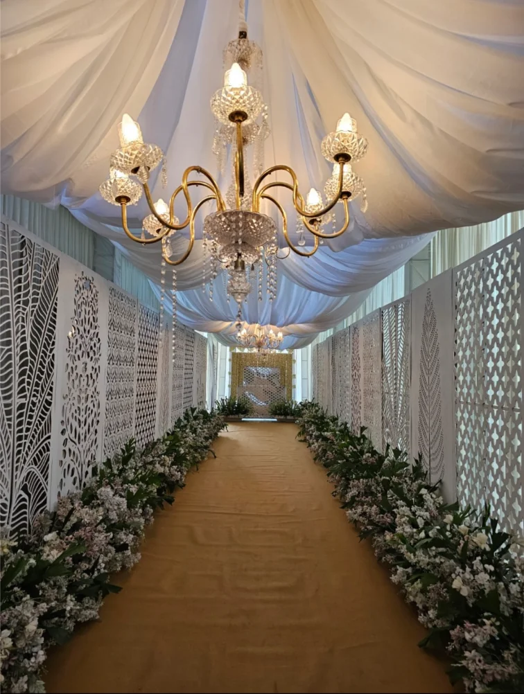 Entrance decor with floral arch and warm lights