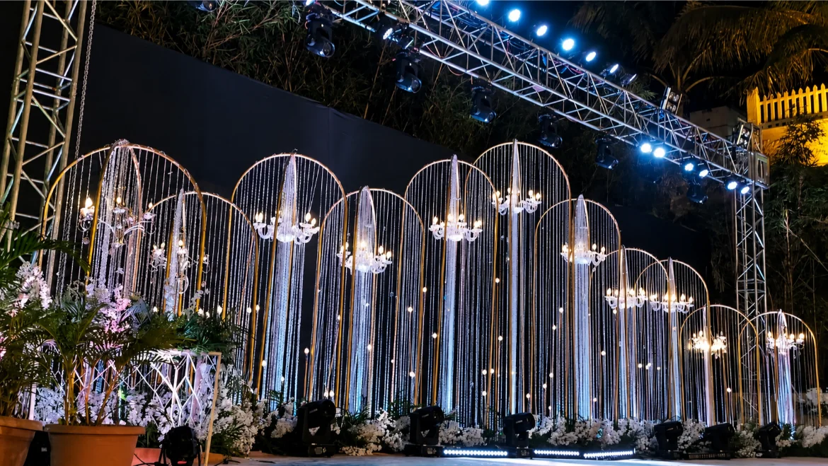 Elegant wedding stage decor with flowers and warm lighting