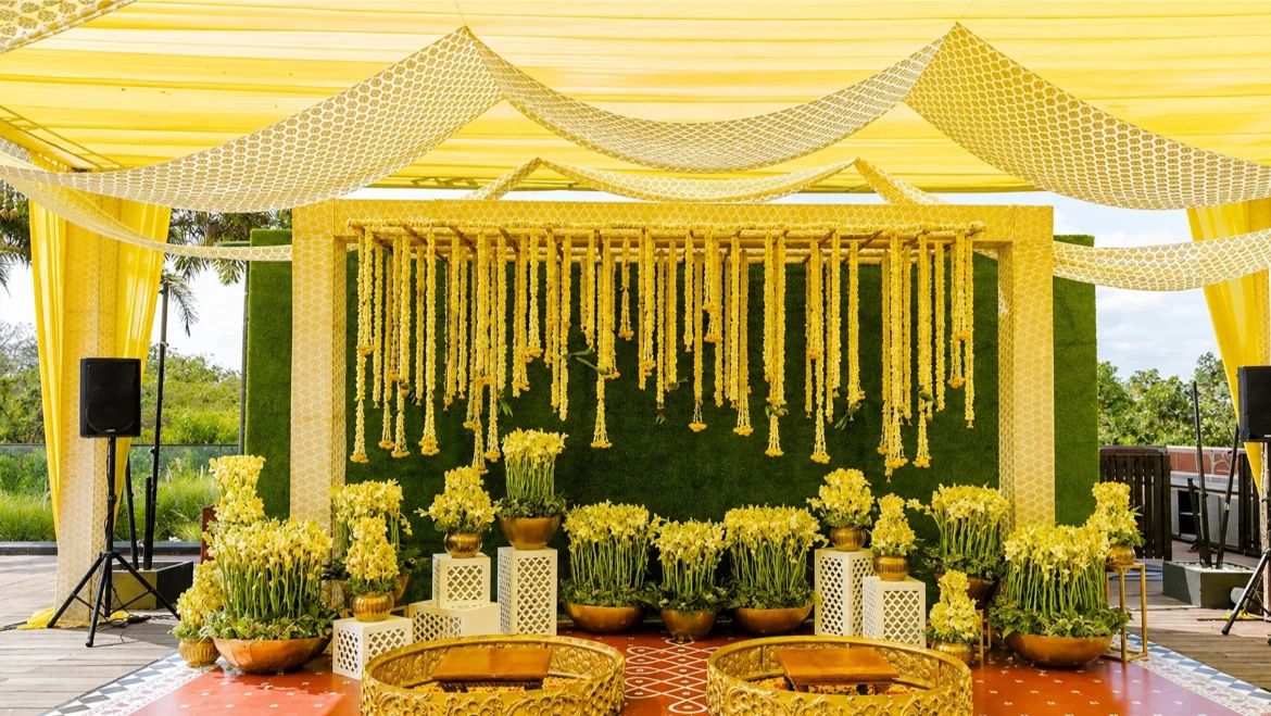 Haldi setup at home with yellow floral decor