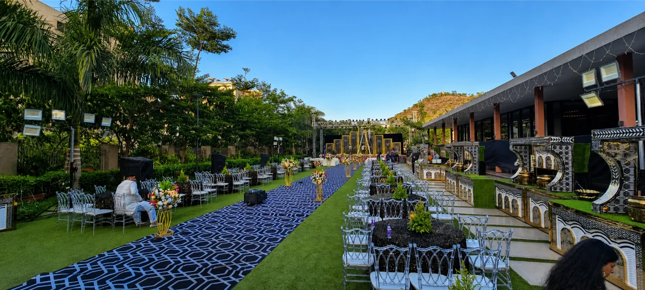 Grand wedding reception decor with floral styling and lights